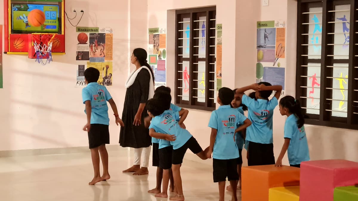 Illustration of children climbing together with the AthScore mascot